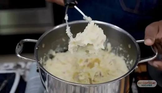 Begin mashing with a potato masher